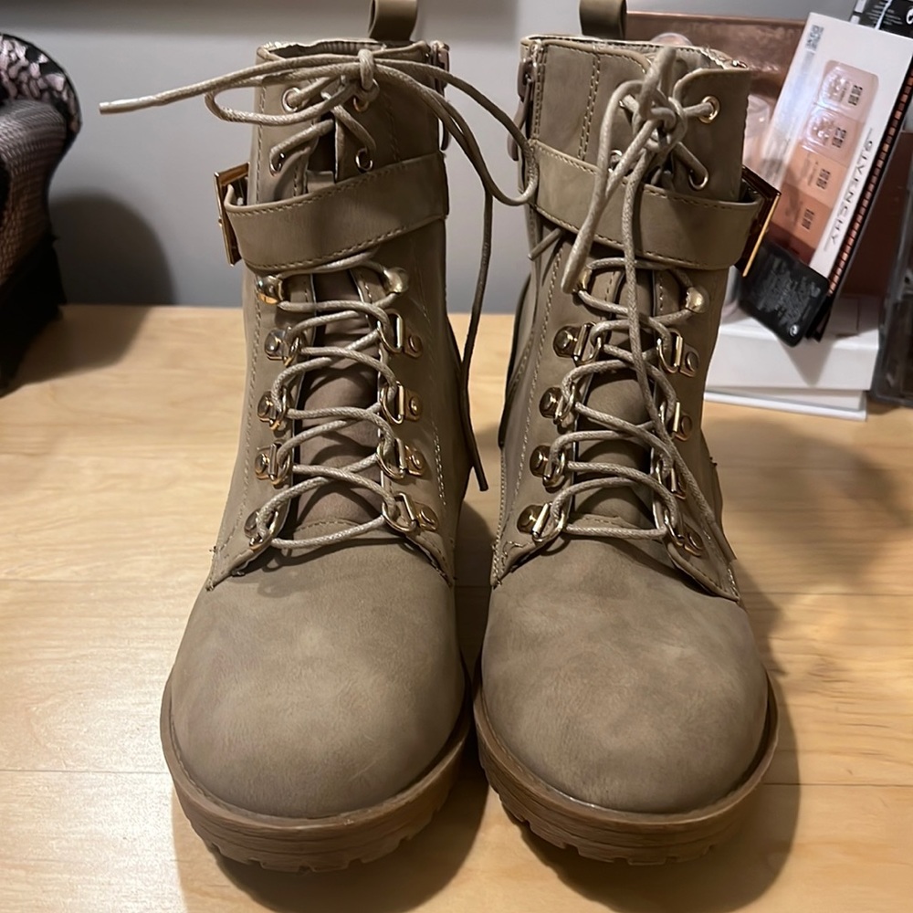 Lace up boots with gold.